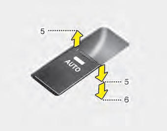Pressing the power window switch momentarily to the second detent position (6)