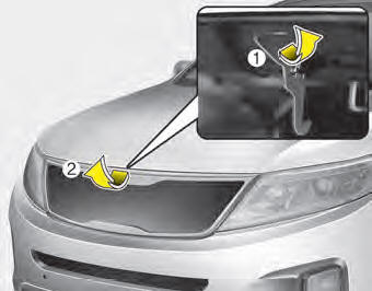 2. Go to the front of the vehicle, raise the hood slightly, pull the secondary