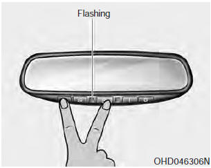 To erase the three programmed buttons (individual buttons cannot be erased):