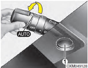 When the light switch is in the AUTO light position, the taillights and headlights