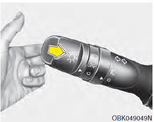 To flash the headlights, pull the lever towards you. It will return to the normal