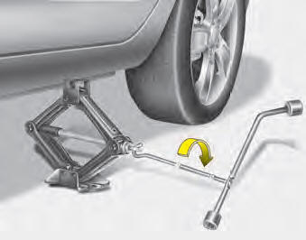 8.Insert the jack handle into the jack and turn it clockwise, raising the vehicle