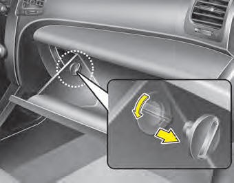 2. With the glove box open, remove the stoppers on both sides.